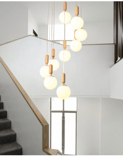 Modern Minimalist Duplex Staircase Long Pendant Light Nordic Creative Stairwell Villa Apartment Magic Bean Rotating Solid Wood Pendant Light